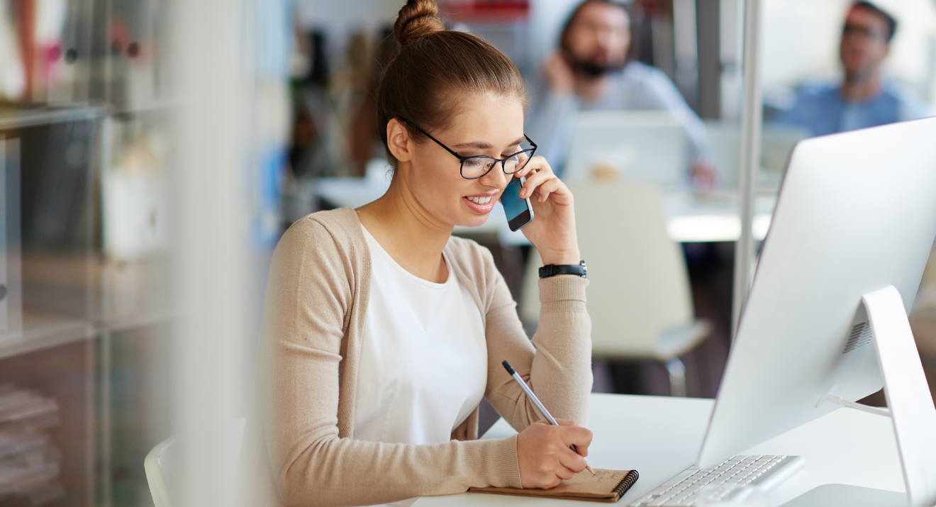 PR professional on phone in office